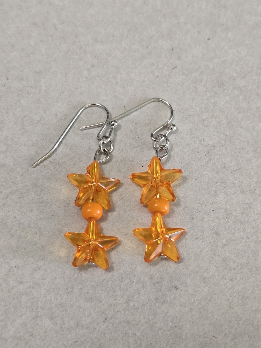 Orange Star Dangle Earrings with Bead Accent
